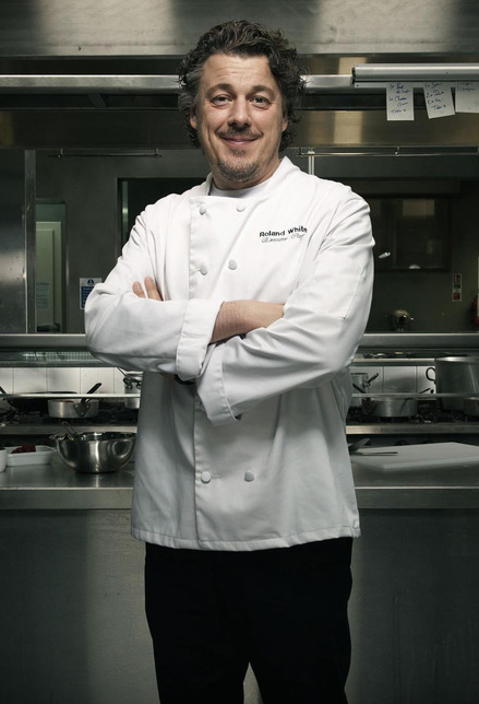 Alan Davies as Roland White